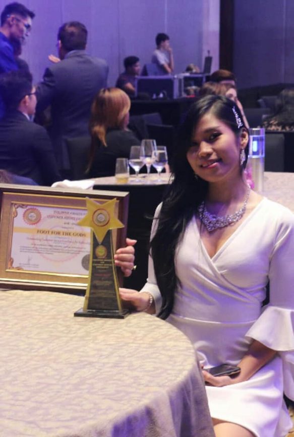 Foot for the gods representative receiving an award